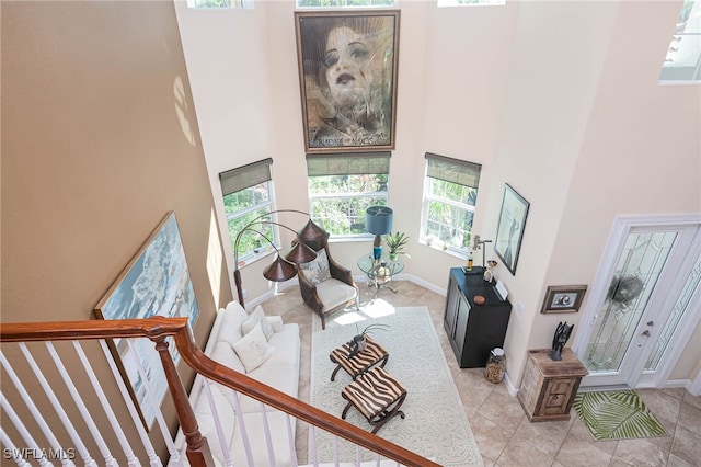 living room featuring a high ceiling