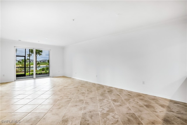 unfurnished room with light tile patterned floors