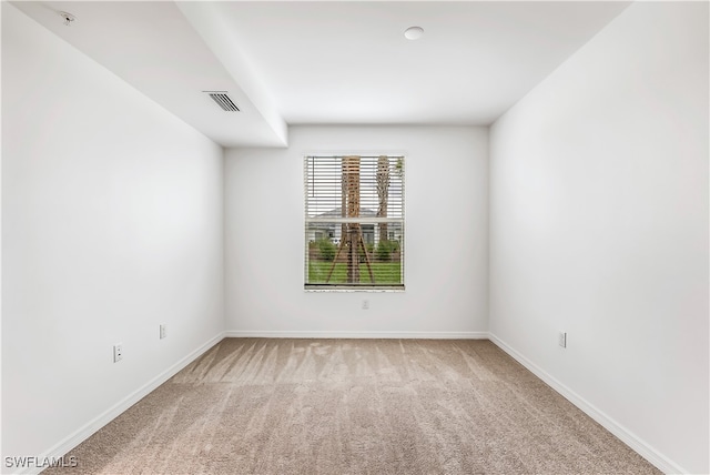 empty room with light colored carpet