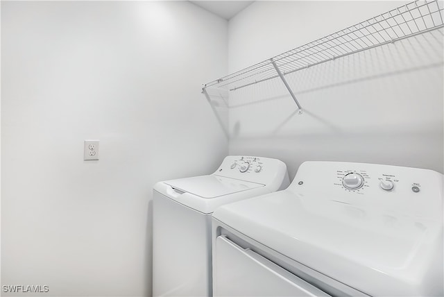 washroom with washer and dryer