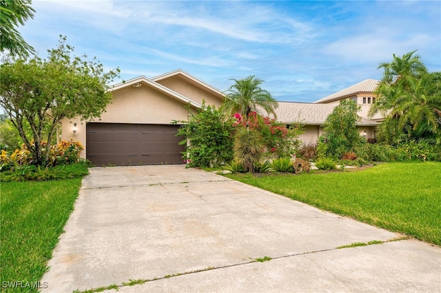 view of front facade featuring a garage and a front yard