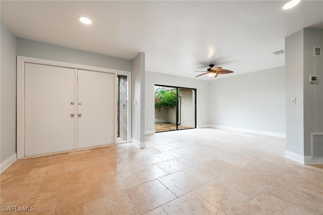 foyer featuring ceiling fan