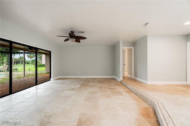 unfurnished room with ceiling fan