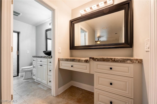 bathroom with vanity and toilet