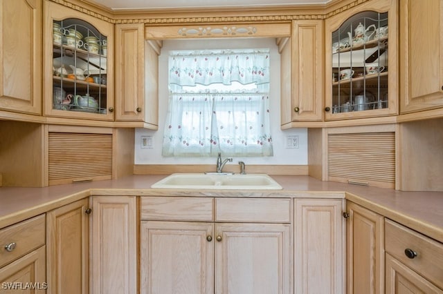 kitchen featuring sink and light brown cabinets