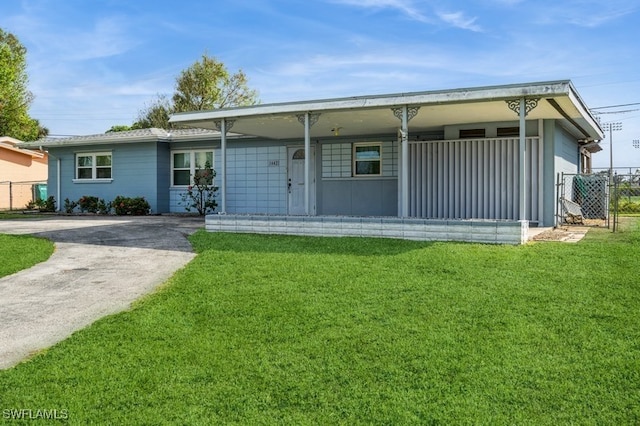 ranch-style home with a front lawn