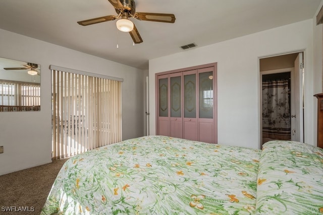 carpeted bedroom featuring a closet, ceiling fan, and multiple windows