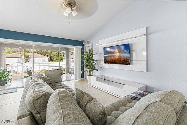 tiled living room featuring ceiling fan and lofted ceiling