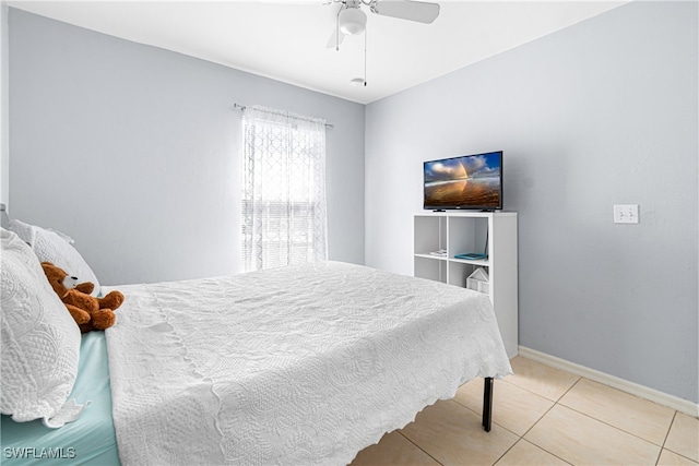 tiled bedroom with ceiling fan