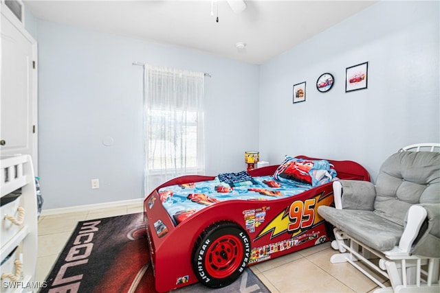 bedroom featuring ceiling fan and light tile patterned floors