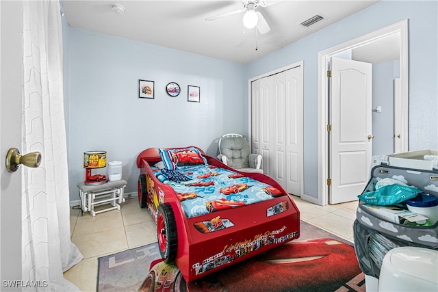 tiled bedroom featuring a closet and ceiling fan