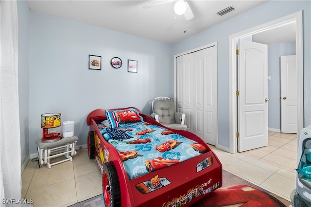 bedroom featuring tile patterned flooring, a closet, and ceiling fan