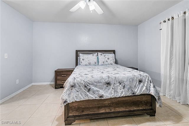 tiled bedroom with ceiling fan