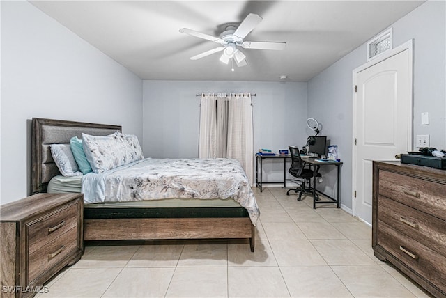 tiled bedroom with ceiling fan