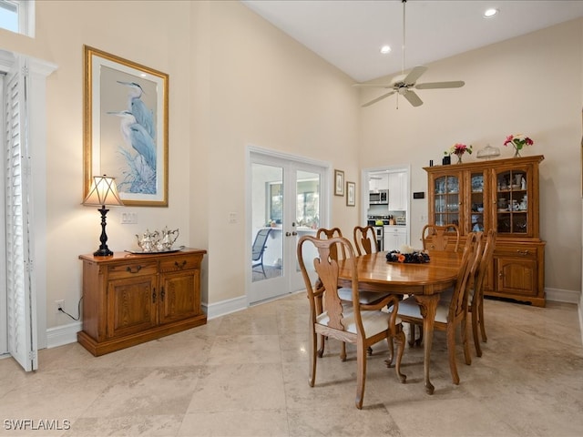 dining area featuring french doors, ceiling fan, and high vaulted ceiling