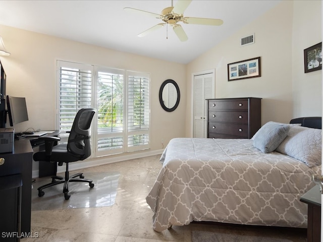 bedroom featuring ceiling fan, a closet, and vaulted ceiling