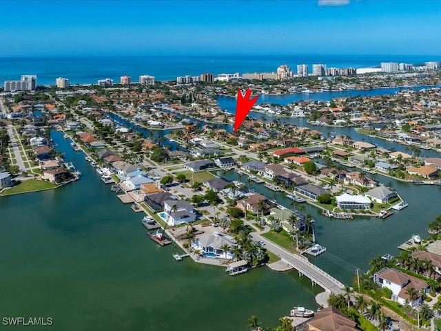 birds eye view of property featuring a water view