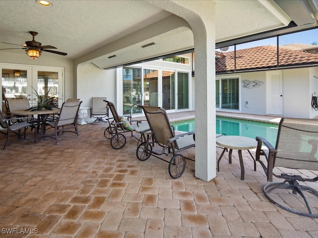 view of patio / terrace with french doors and ceiling fan