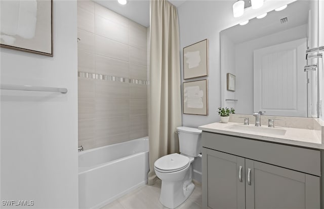 full bathroom featuring tile patterned flooring, vanity, toilet, and shower / bath combination with curtain