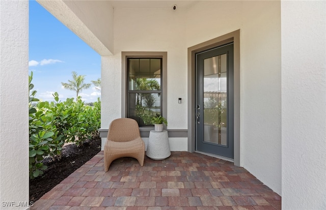 doorway to property with a patio