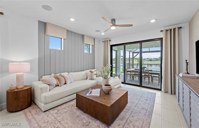 tiled living room featuring ceiling fan