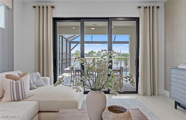 doorway to outside with light tile patterned floors