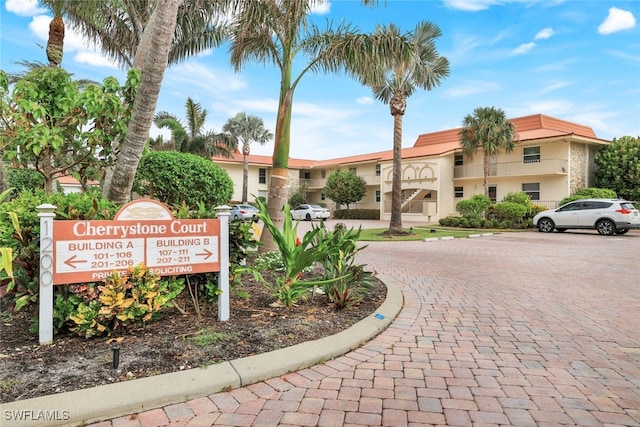 1200 Cherrystone Ct Unit B209, Naples, FL 34102 - view of building exterior featuring uncovered parking