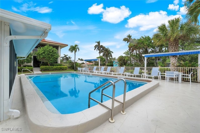 view of pool featuring a patio