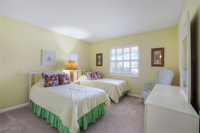 carpeted bedroom with a textured ceiling