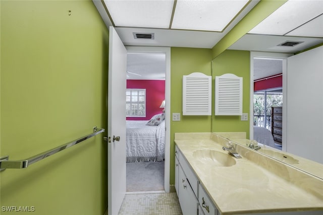 bathroom featuring tile patterned flooring and vanity