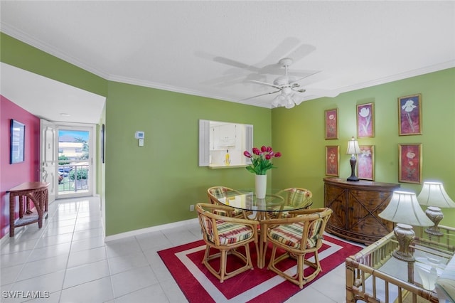 dining space with ceiling fan, light tile patterned floors, and crown molding