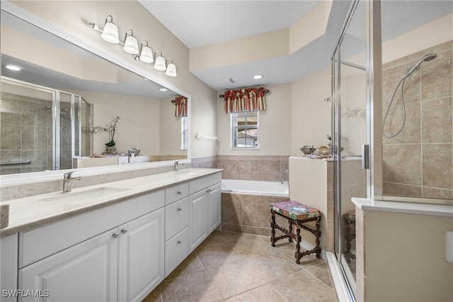 bathroom featuring vanity, tile patterned floors, and separate shower and tub