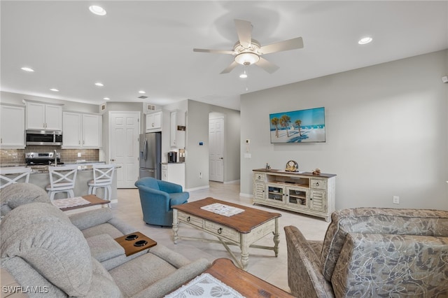 tiled living room featuring ceiling fan