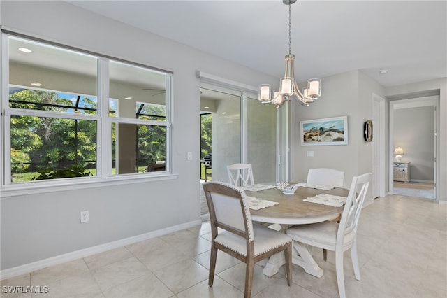 tiled dining space with a notable chandelier