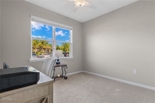 home office featuring ceiling fan and light colored carpet