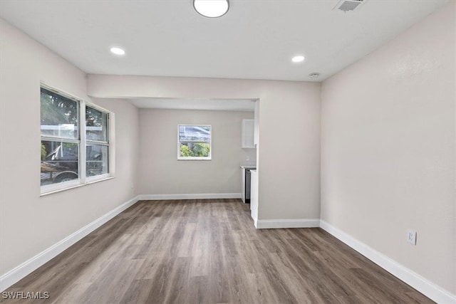 unfurnished room featuring hardwood / wood-style floors