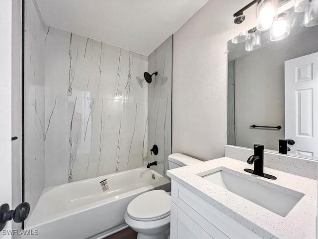 full bathroom with toilet, vanity, and tiled shower / bath