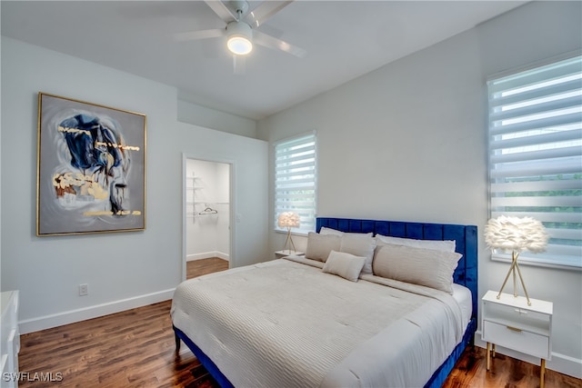 bedroom with ceiling fan and hardwood / wood-style floors