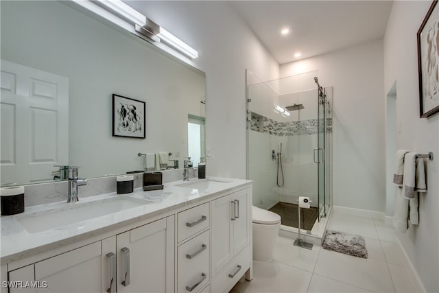 bathroom with tile patterned floors, vanity, toilet, and walk in shower