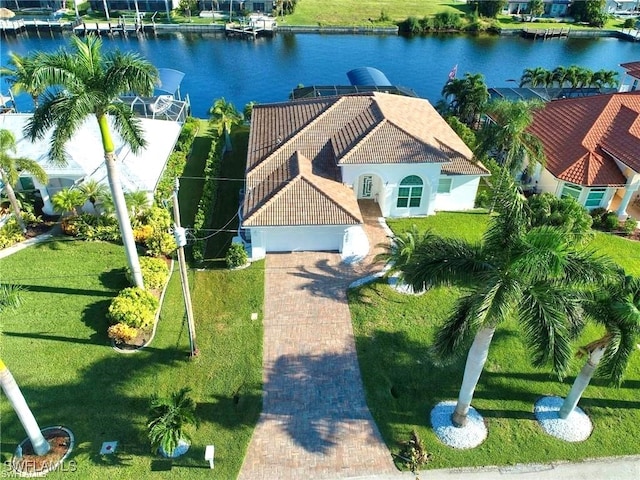 birds eye view of property with a water view