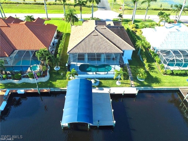 birds eye view of property with a water view