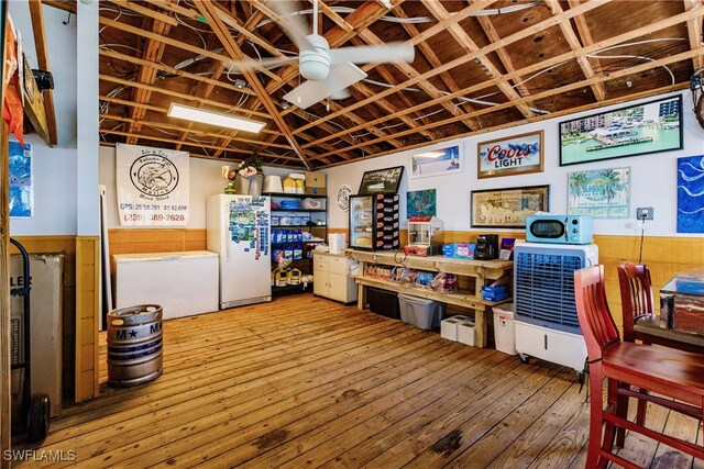 interior space featuring ceiling fan and wood-type flooring