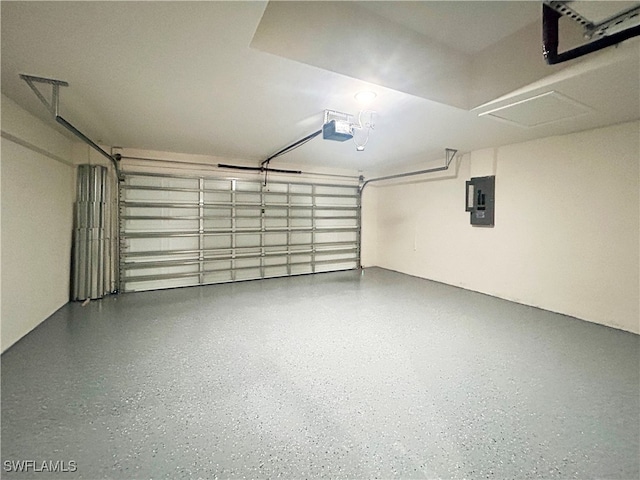 garage featuring electric panel and a garage door opener