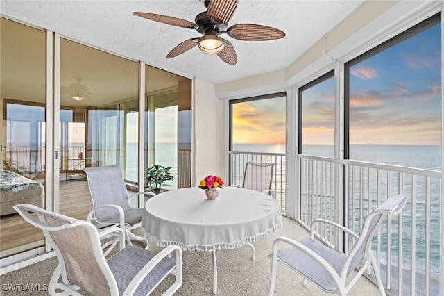 sunroom with a water view