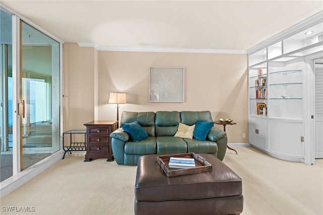 living area with baseboards, carpet floors, and ornamental molding
