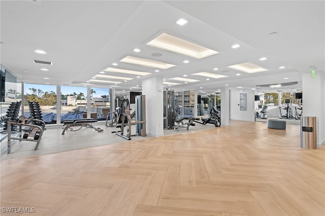 exercise room with light parquet floors