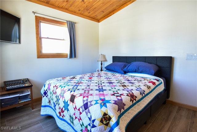 bedroom with lofted ceiling, wooden ceiling, and dark wood-type flooring