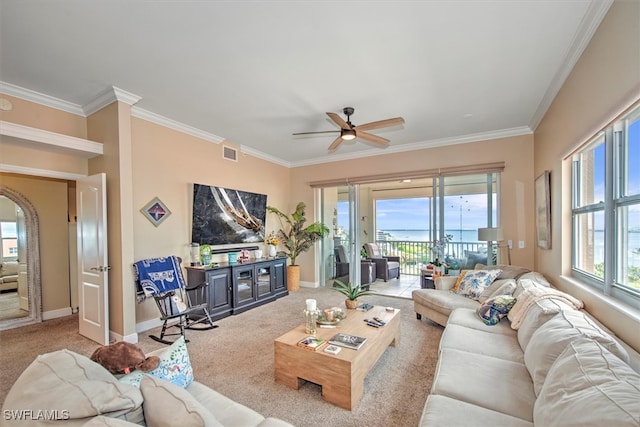 living room featuring carpet flooring, crown molding, and ceiling fan