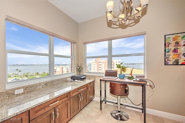 tiled office space with a water view and an inviting chandelier