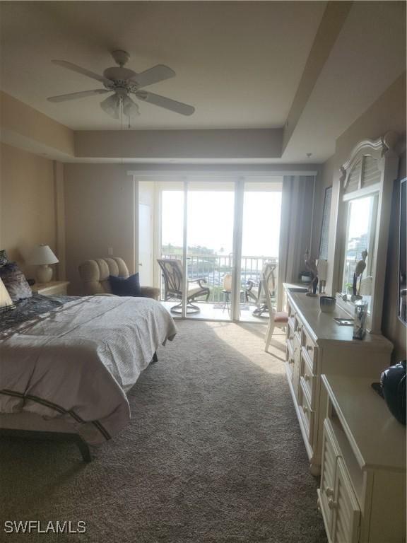 carpeted bedroom featuring access to exterior and a ceiling fan